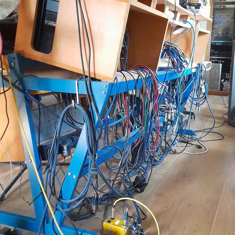 Cables behind the recording desk at Riverfish Studios
